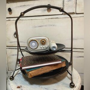 Modern chrome dessert stand with a sleek mid-century modern feel.